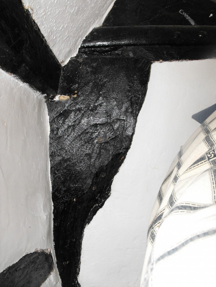 Jowelled post which flares out at the top of the post where it connects to the wall plate and tie beam above.