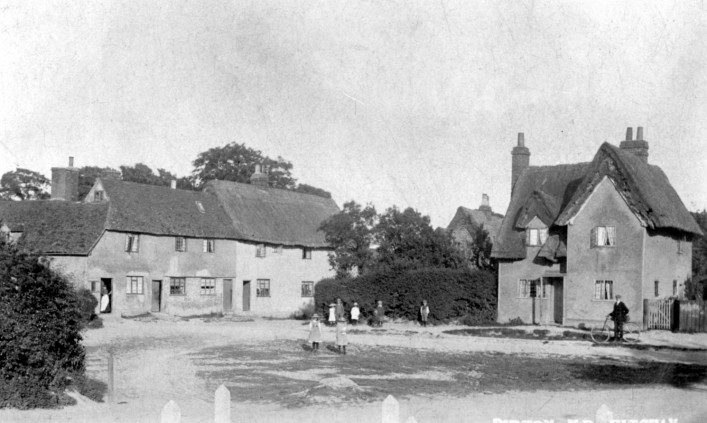 The window in the left hand bedroom is a dormer window in the thatch.