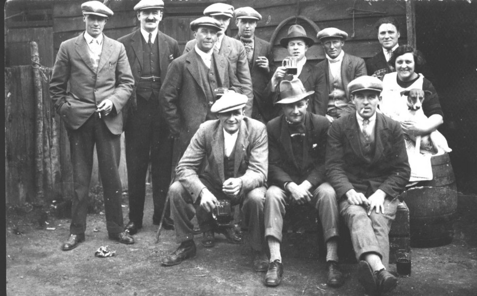 1938 A group of regulars outside the Red Lion with the landlord Matt Mackenzie. Back row L-R: Cecil Day, Matt Mackenzie, Bob Males, Charlie Males, George Males, Len Dawson, Phil Reynolds, Mrs Newberry, cleaner. Front row L-R: Cecil Stapleton, Len Baines, Fred Furr.